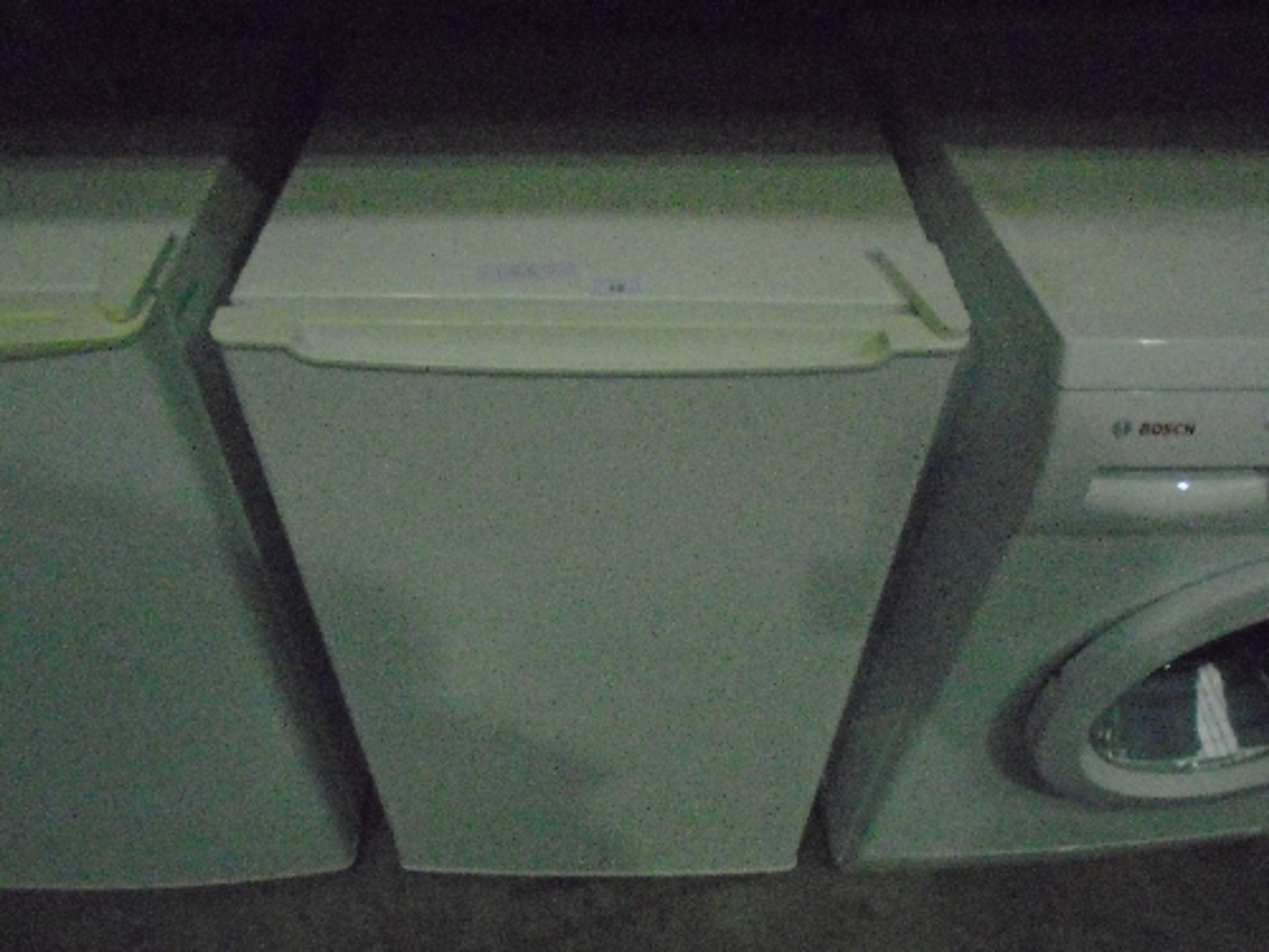 A white under counter fridge