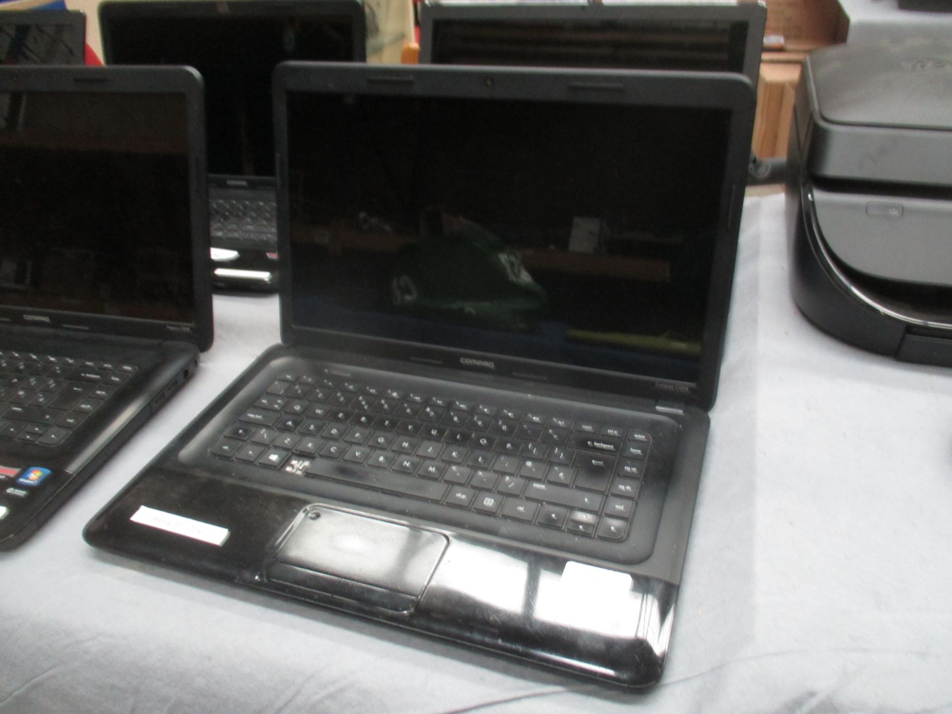 A Compaq CQ58 laptop computer with power lead (please note missing one key button)