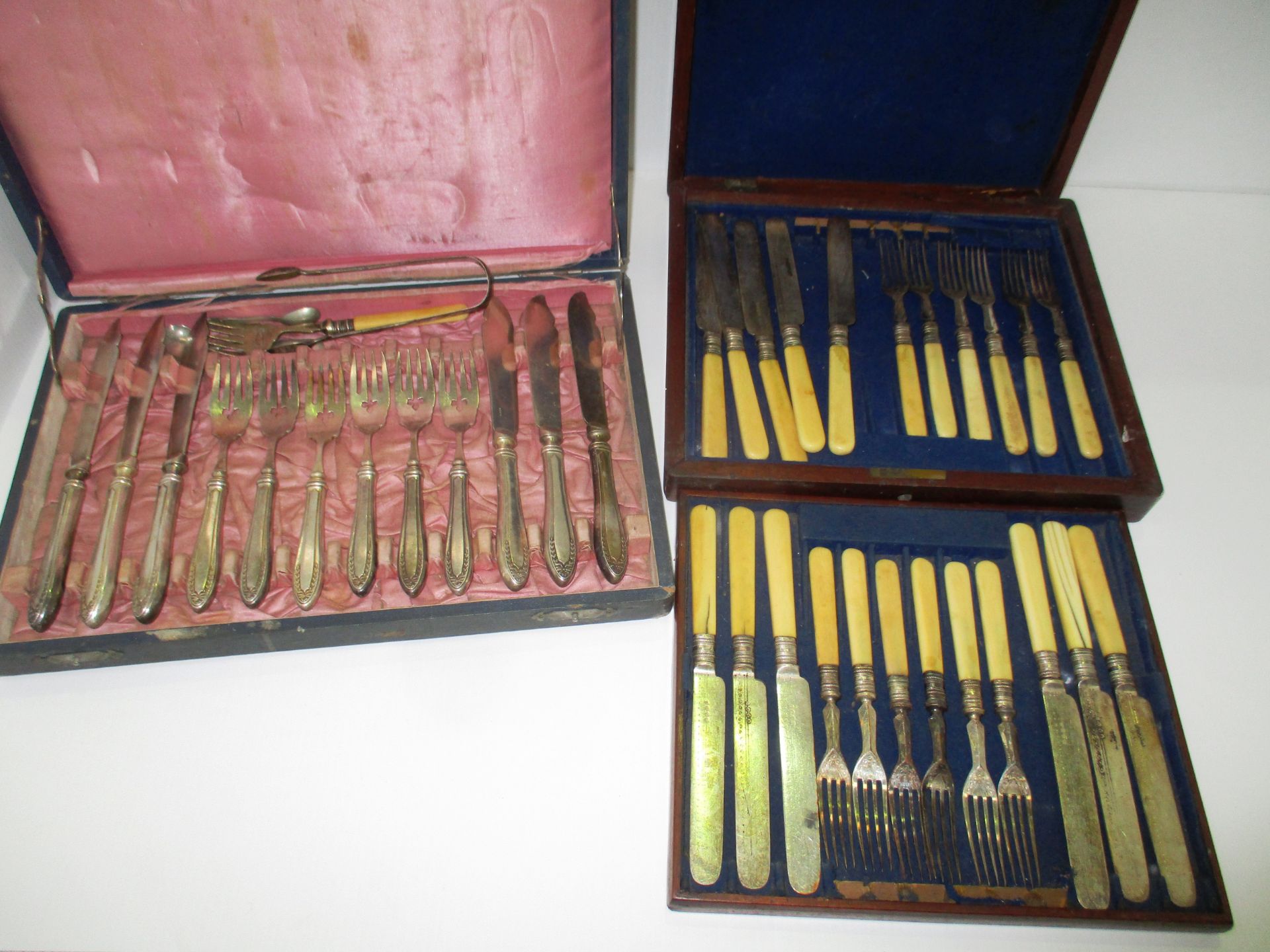 A canteen of plated cutlery in fitted mahogany case and another canteen of cutlery