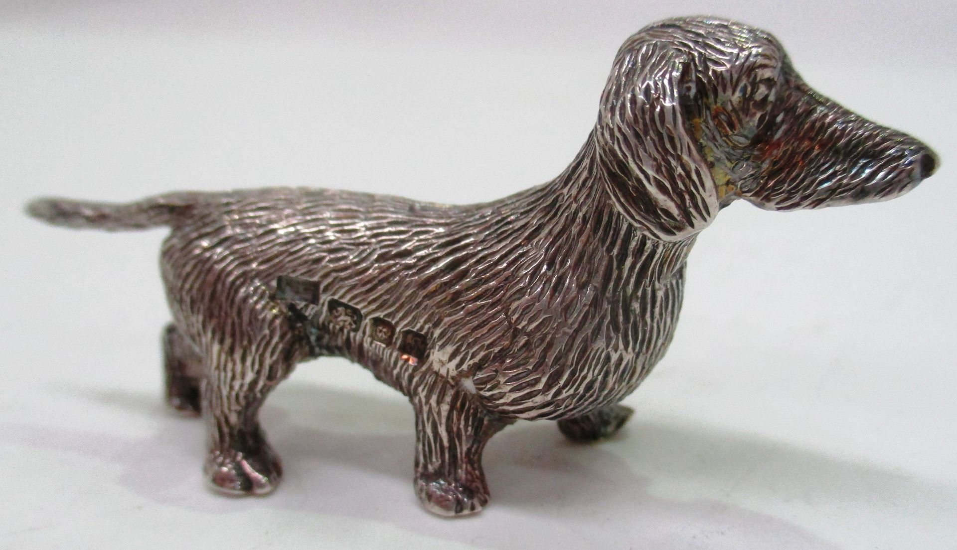 A miniature cast silver model of a Dachshund dog, London 1973 (approximate weight 1.