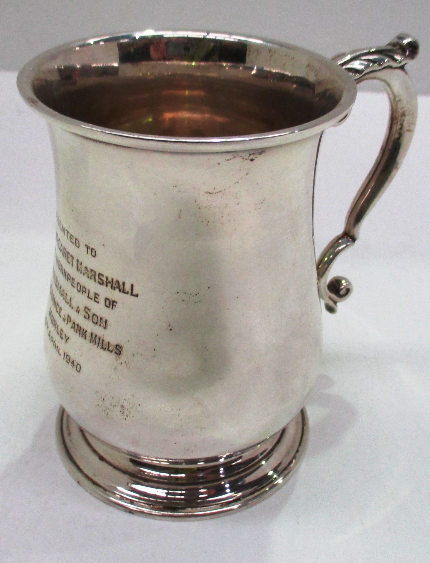 A silver half pint baluster mug with scroll handle, Chester 1939, 10cm (total approximate weight 6.