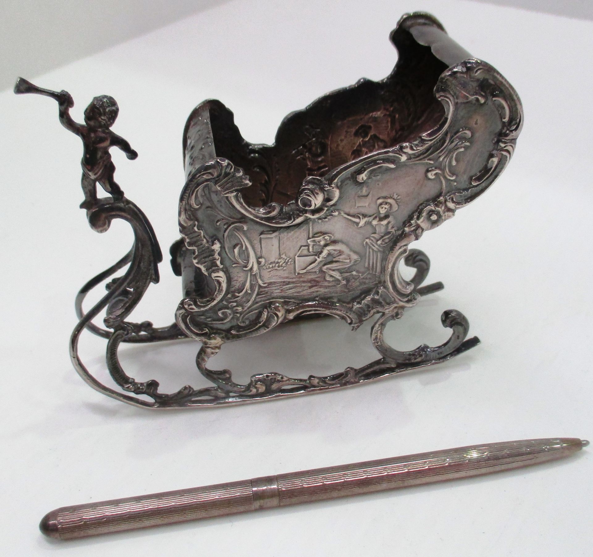 An early 20th century Dutch 930 standard silver vase formed as a sled,