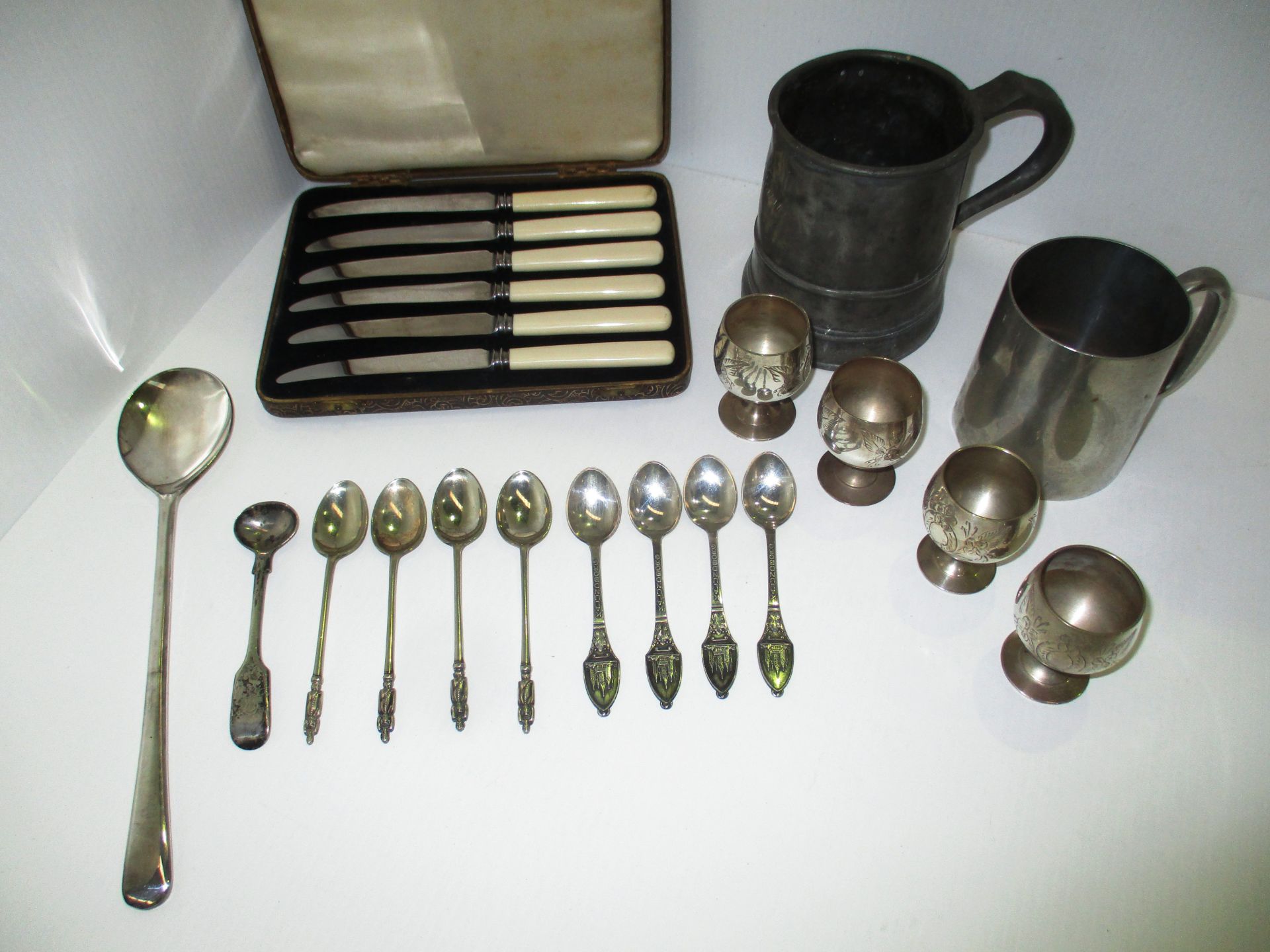 Small quantity of plated cutlery and two pewter tankards