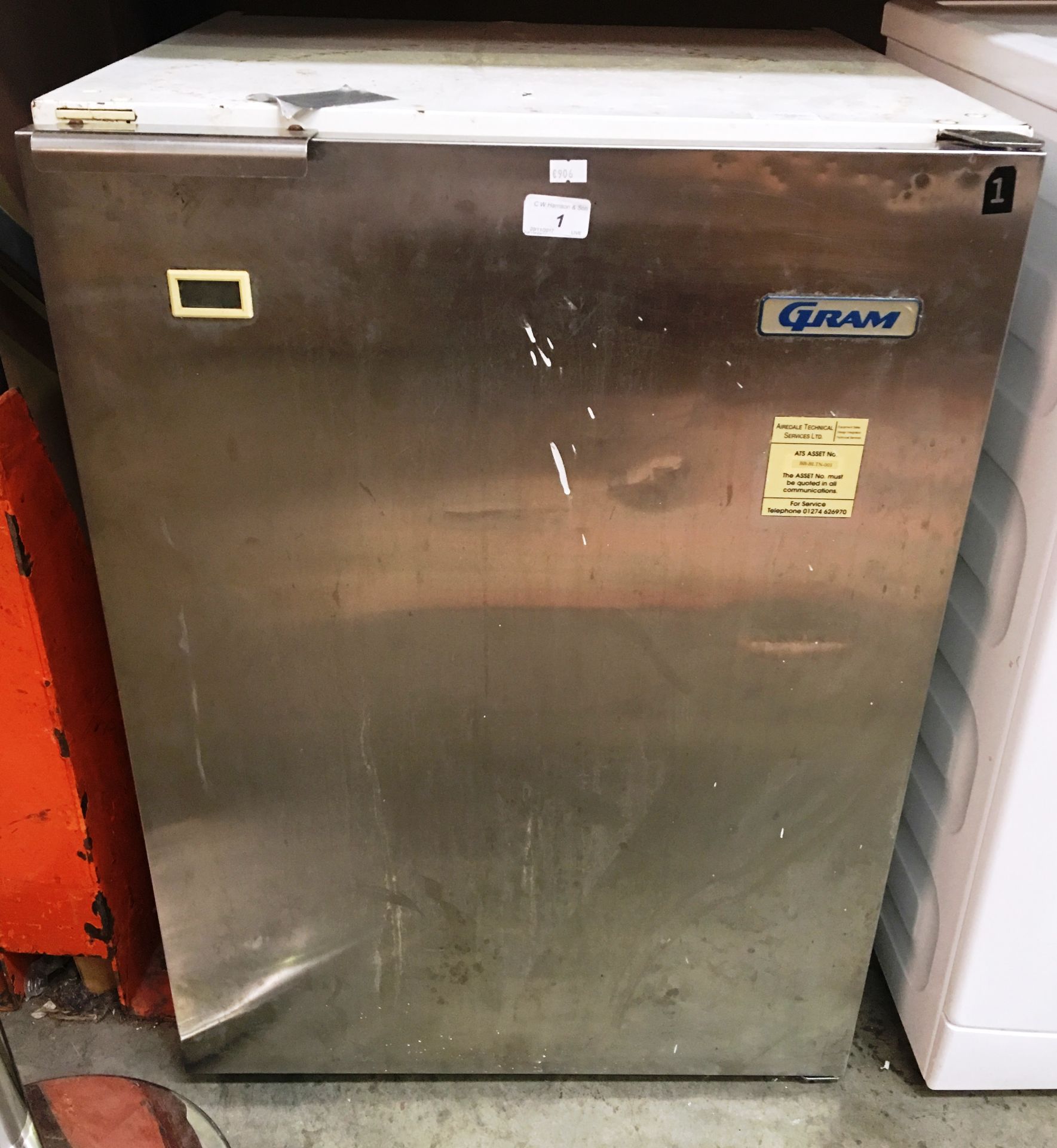 A Gram single door stainless steel under counter fridge (damaged flex cut off)