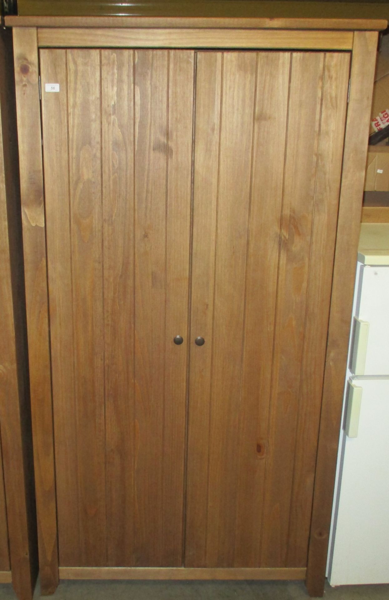 A modern stained pine finish two door wardrobe 100 x 188cm
