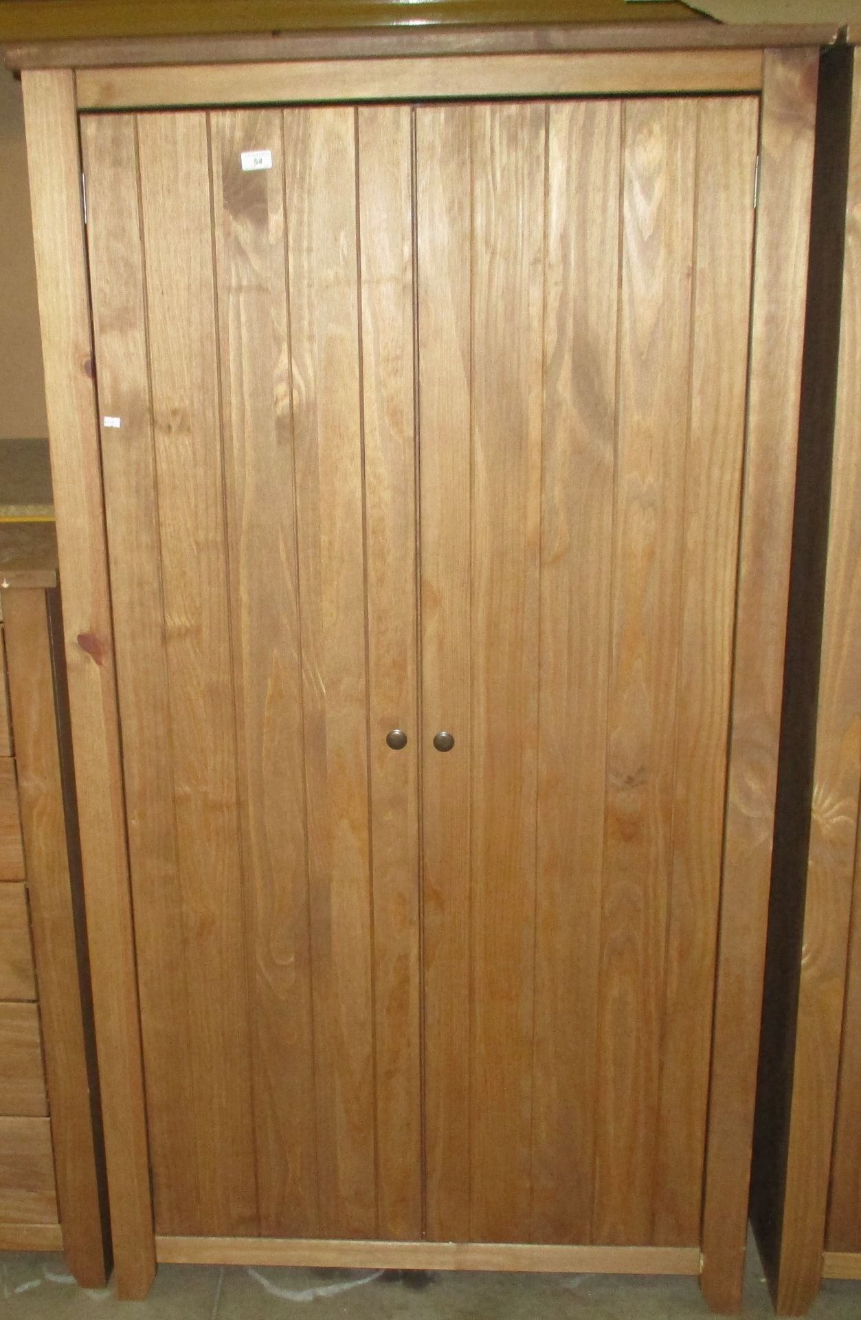 A modern stained pine finish two door wardrobe 100 x 188cm