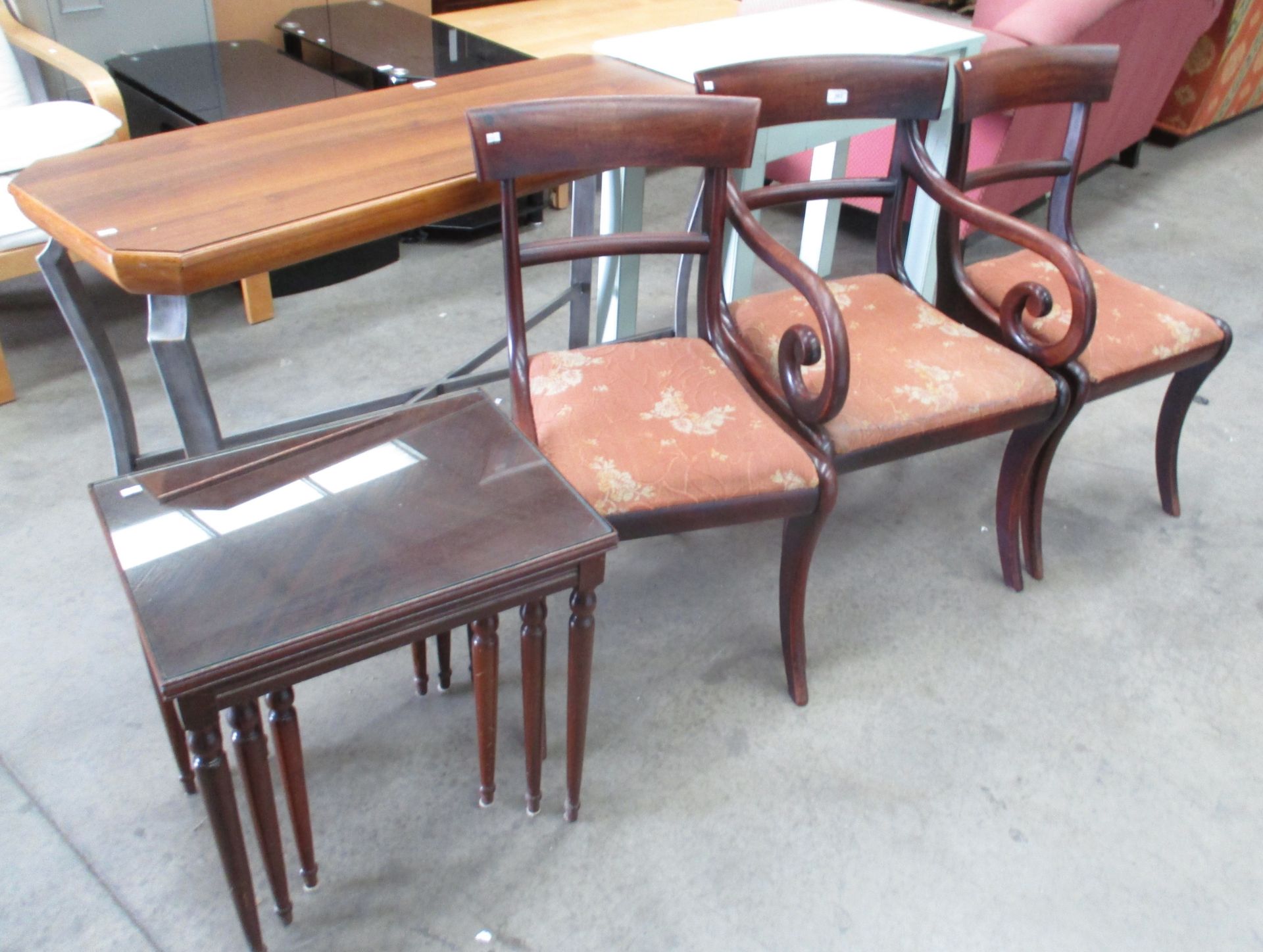 Three mahogany bar back dining chairs (one armchair) and a mahogany nest of three coffee tables