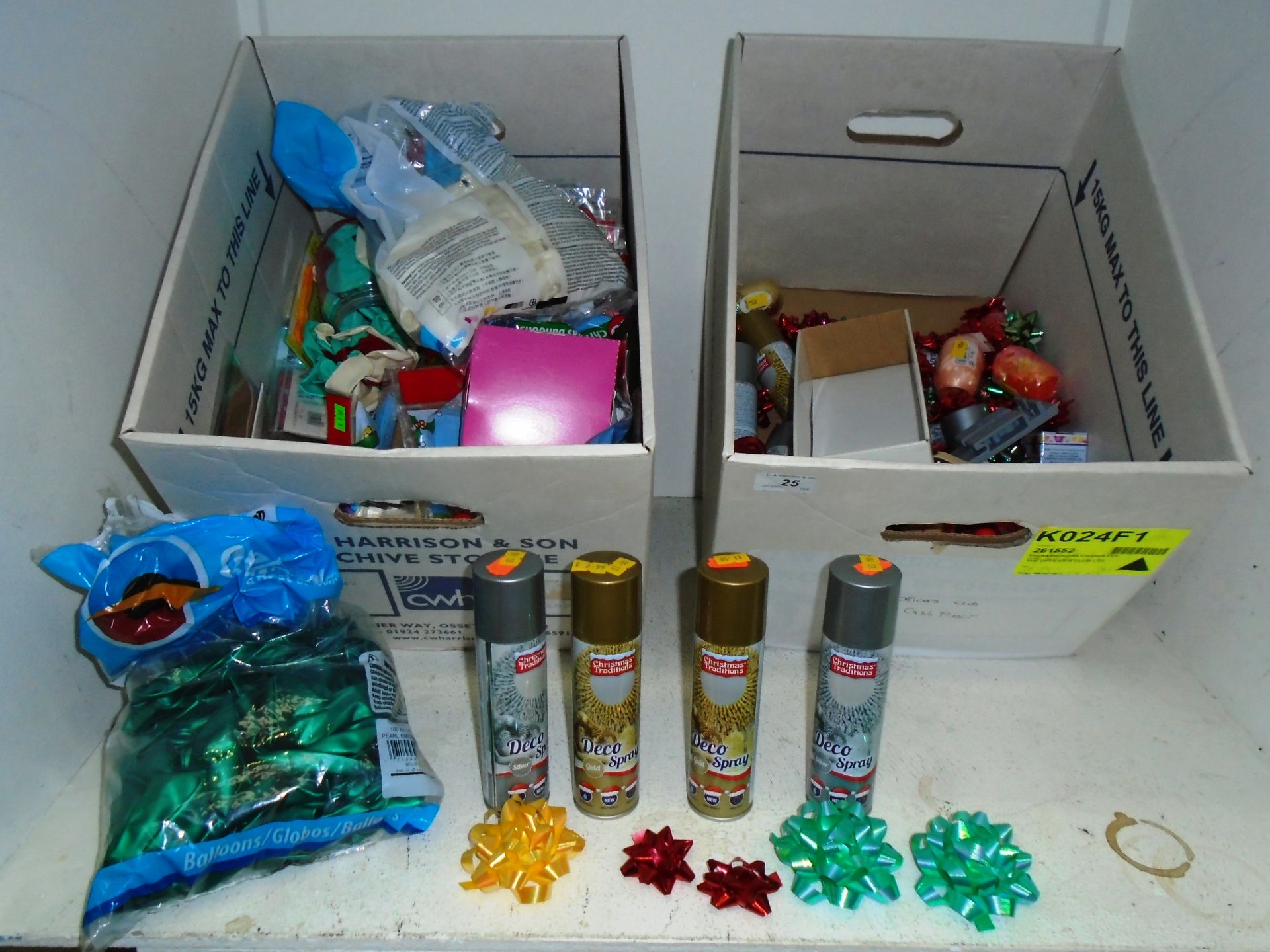 Contents to two boxes - packs of balloons, 150ml tins of Deco-Spray, rolls of ribbon,