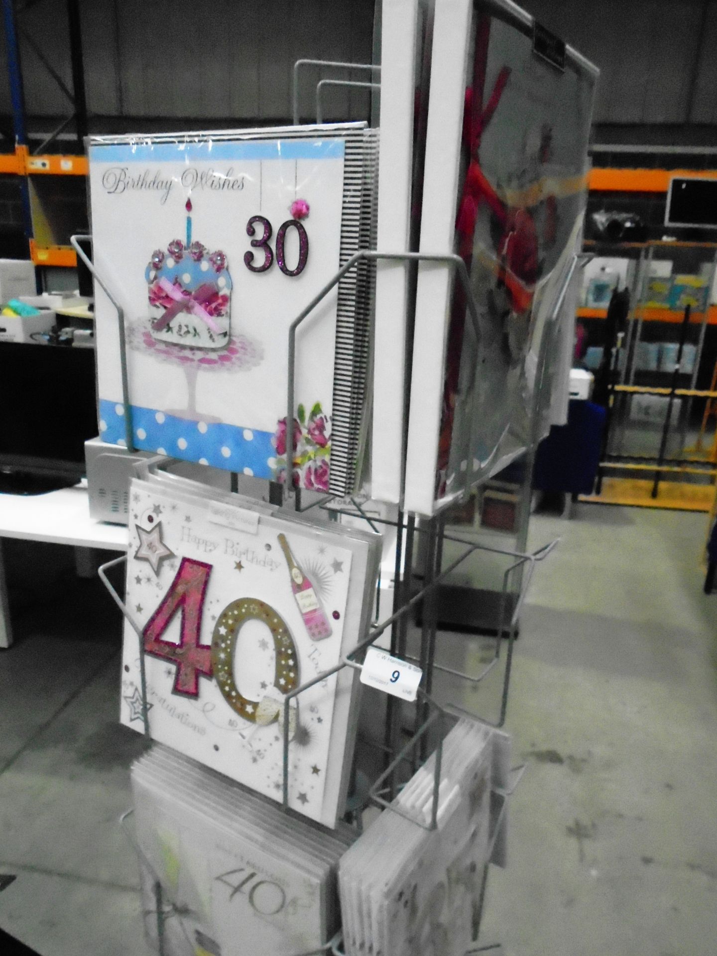 A grey metal swivel display stand complete with approximately 50 x assorted greetings cards