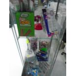 Contents to glass display cabinet assorted sweets, light up hand spinners,