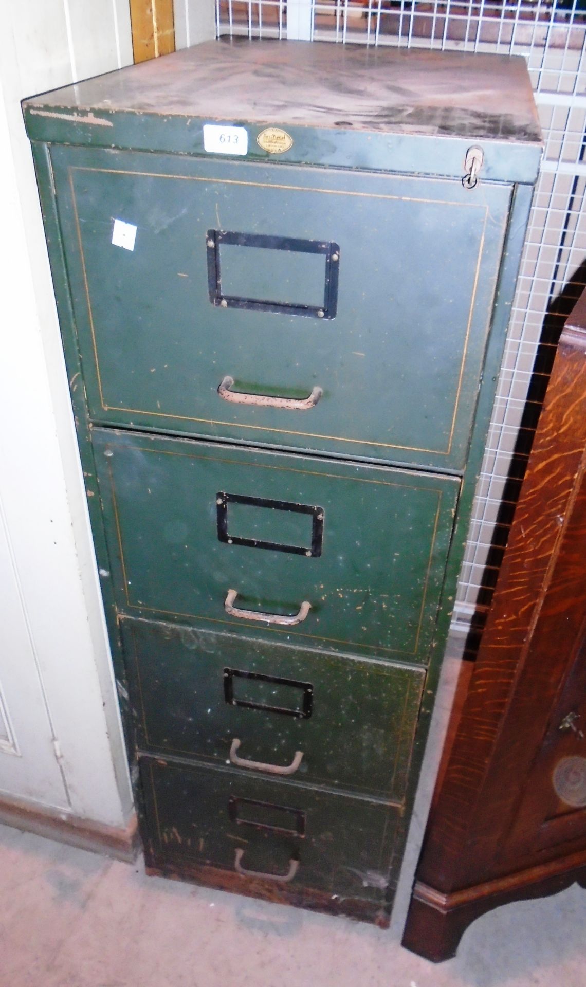 An Art Metal green metal 4 drawer filing cabinet