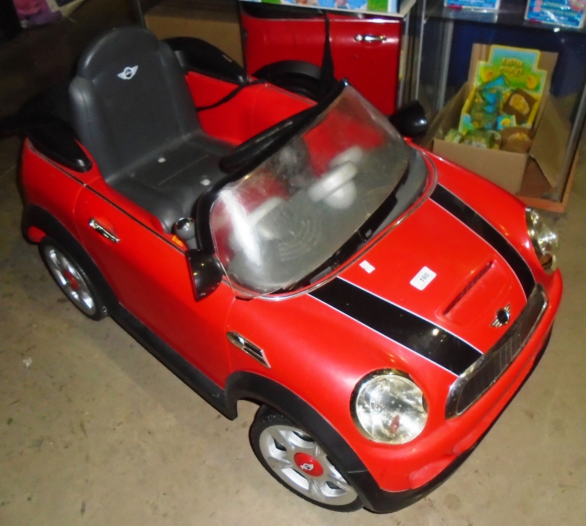 A Mini Cooper children's battery powered ride on car complete with charger