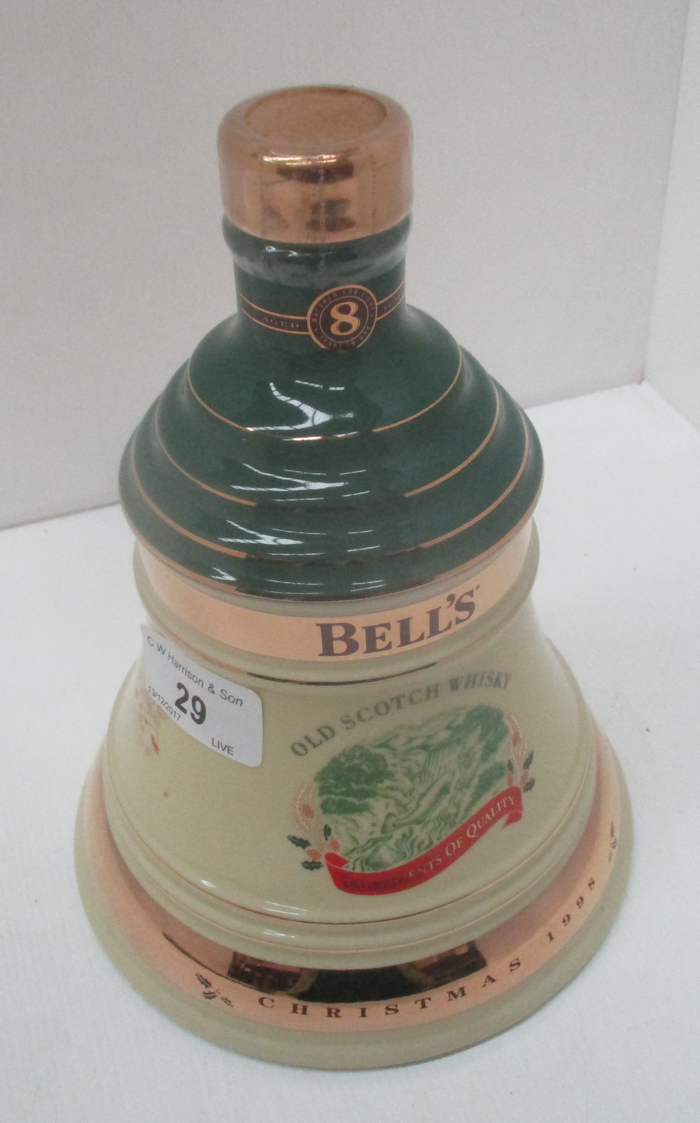 A 70cl Wade porcelain decanter containing Bell's Extra Special Old Scotch Whisky [aged 8 years] for