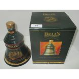 A 70cl Wade porcelain decanter containing Bell's Extra Special Old Scotch Whisky for Christmas 1995