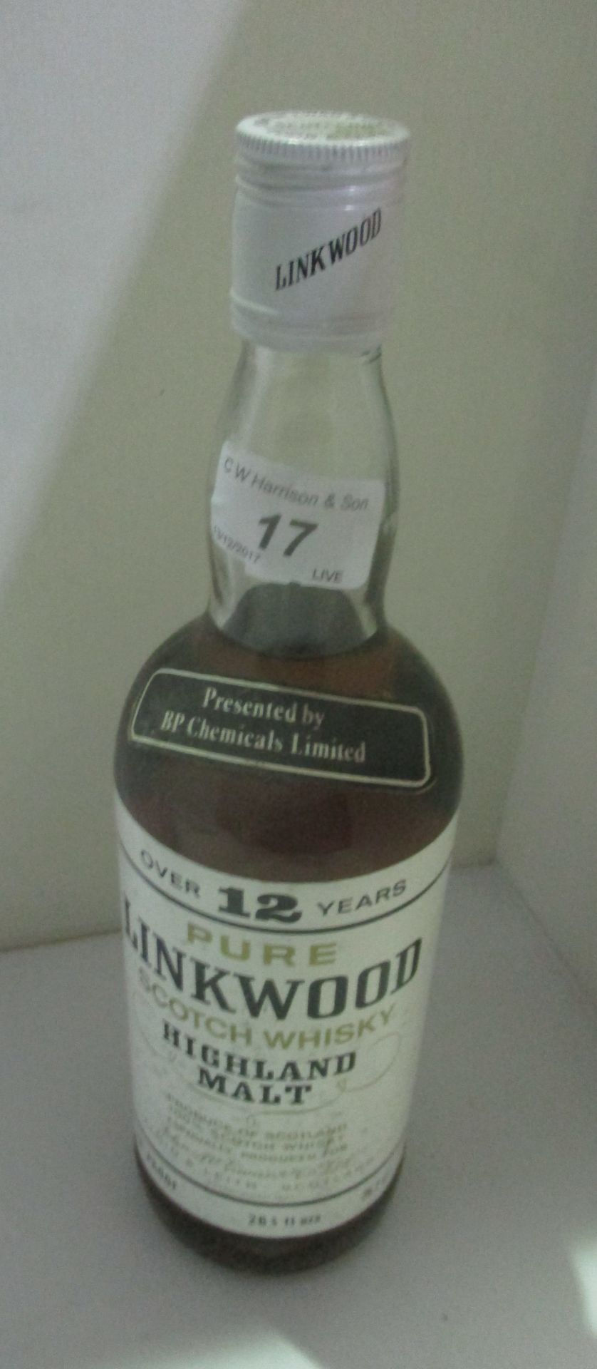 A presentation bottle - 26 and 2/3 fluid oz.