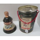 A 75cl Wade porcelain decanter containing Bell's Extra Special Old Scotch Whisky for Christmas 1990