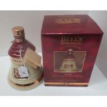 A 70cl Wade porcelain decanter containing Bell's Extra Special Old Scotch Whisky [aged 8 years] for