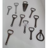 A collection of 11 metal bottle openers