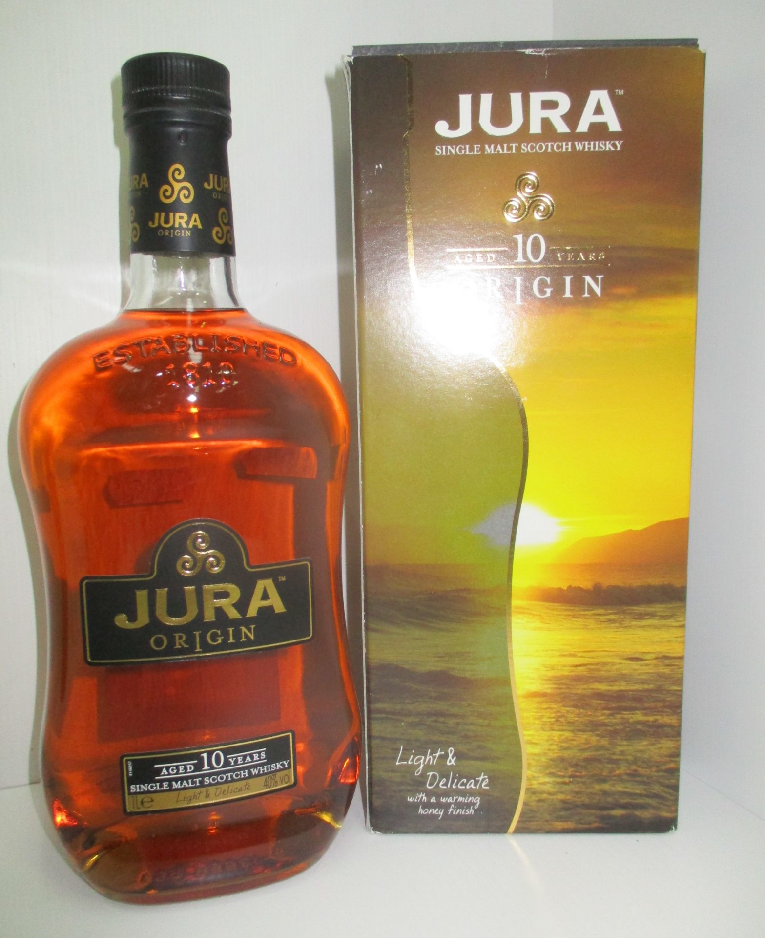 A one litre bottle of Jura Origin aged 10 years single malt Scotch Whisky in presentation box