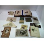 An Early Edwardian photograph album and a small quantity of loose xmas cards,