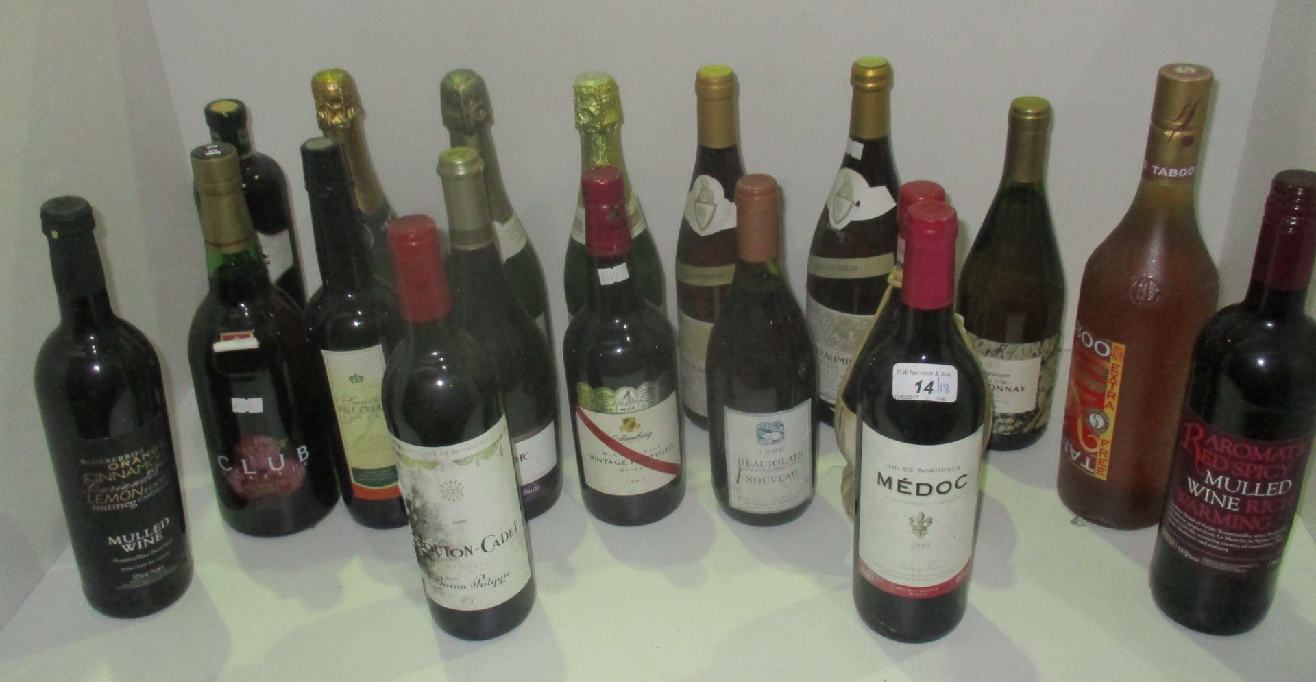 A mixed selection of 18 mainly 75cl/750ml bottles of wines and sherry including a 2002 Medoc,