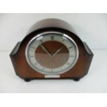 A mahogany cased Westminster chime mantel clock by the Alexander Clark Co Ltd presented by British