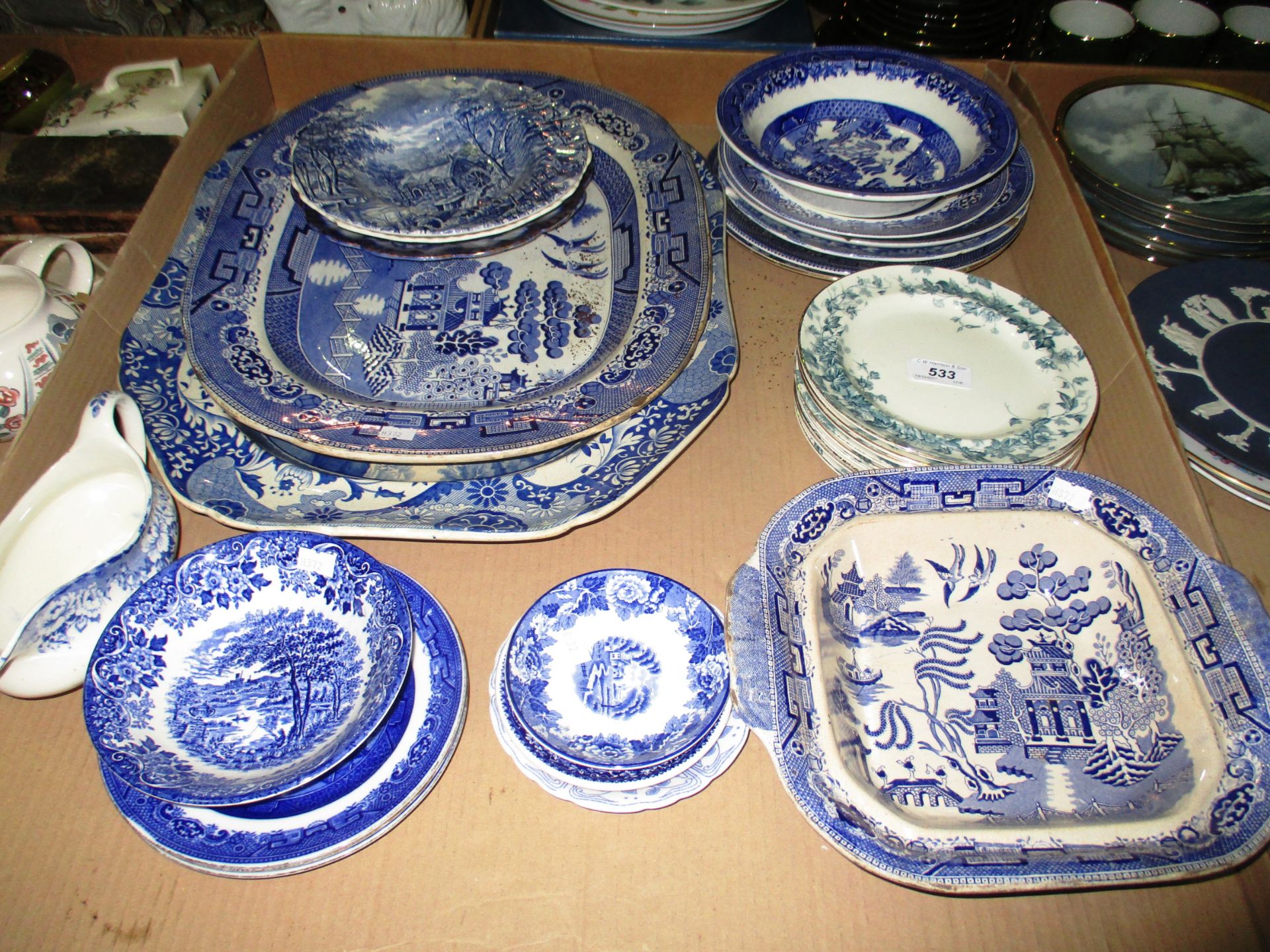 A quantity of blue and white china - two large meat plates, bowls, plates, gravy jug,