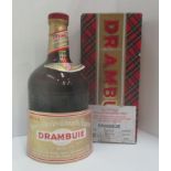 A one litre bottle of Prince Charles Edwards liqueur Drambuie in presentation box - label loose