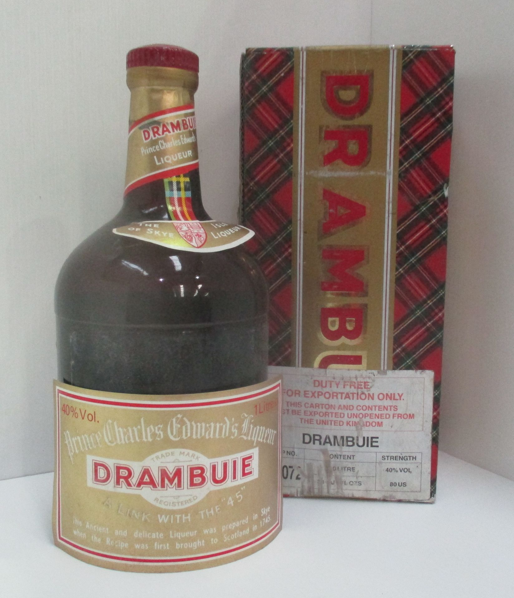 A one litre bottle of Prince Charles Edwards liqueur Drambuie in presentation box - label loose