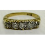 An 18ct gold five stone diamond ring (total approx weight 2.