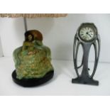 A continental pottery lamp base and shade and an Art Deco mantel clock