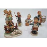 Five assorted Hummel figurines including 'Skier Boy' and 'Joyful 53'