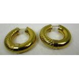 A pair of large hoop earrings (marked 750) (total large approx weight 13.