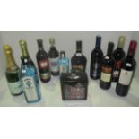 A mixed lot of 15 bottles of wines and spirits including a 50cl bottle of Bombay Sapphire gin,