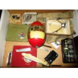 Contents to tray - a chemists weights set, two autograph books, a decorative painted egg,