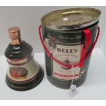 A 70cl Wade porcelain decanter containing Bell's Extra Special Old Scotch Whisky for Christmas 1991