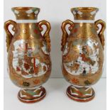 A pair of Satsuma pottery baluster vases with gilt handles,