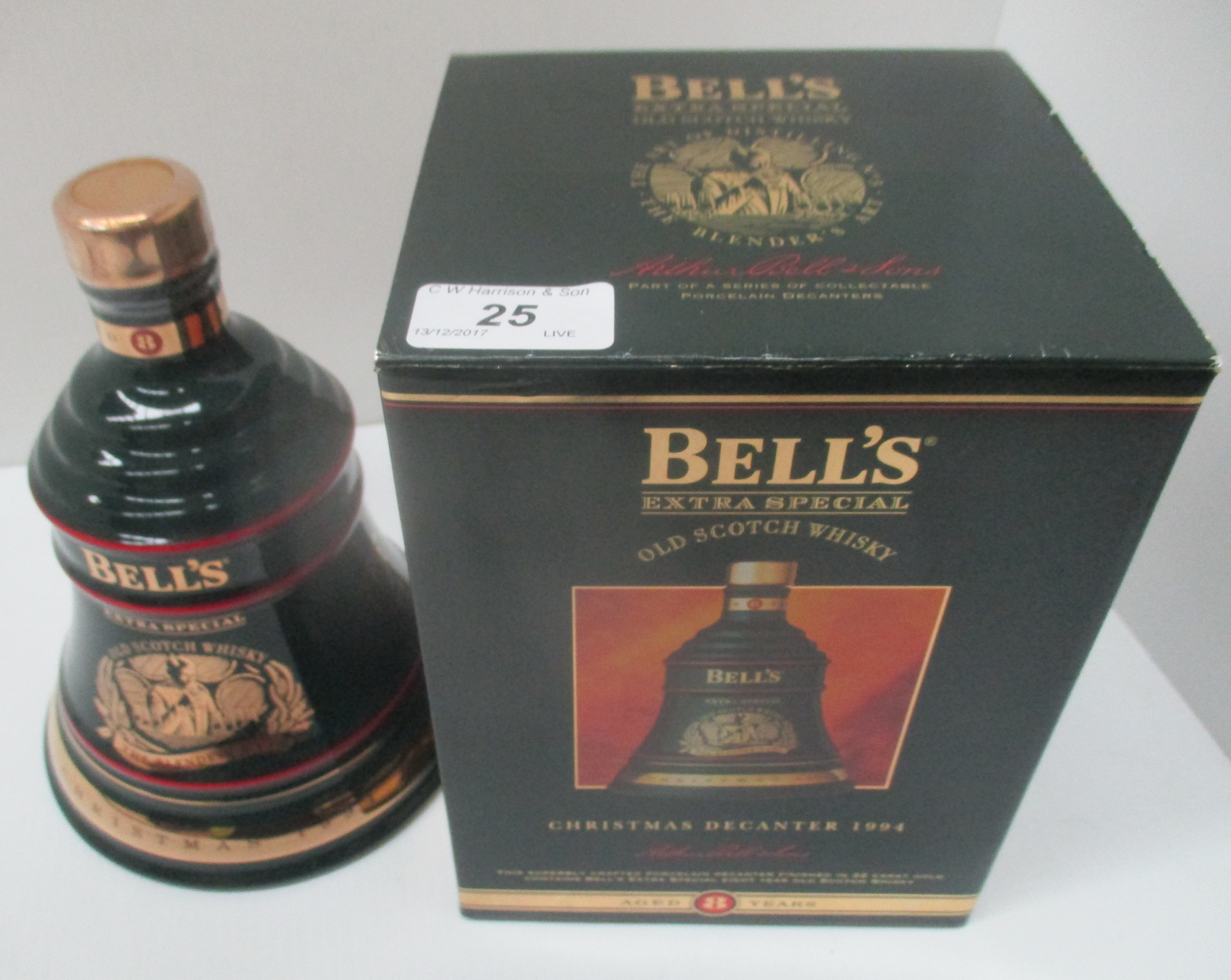 A 70cl Wade porcelain decanter containing Bell's Extra Special Old Scotch Whisky for Christmas 1994