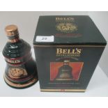 A 70cl Wade porcelain decanter containing Bell's Extra Special Old Scotch Whisky for Christmas 1994