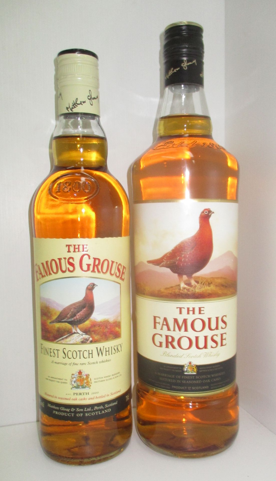 A one litre bottle of The Famous Grouse blended Scotch Whisky and a 70cl bottle of The Famous