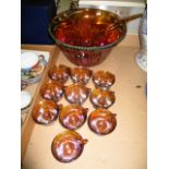 An Iridescent Carnival glass punch bowl and ladle with 10 x matching cups