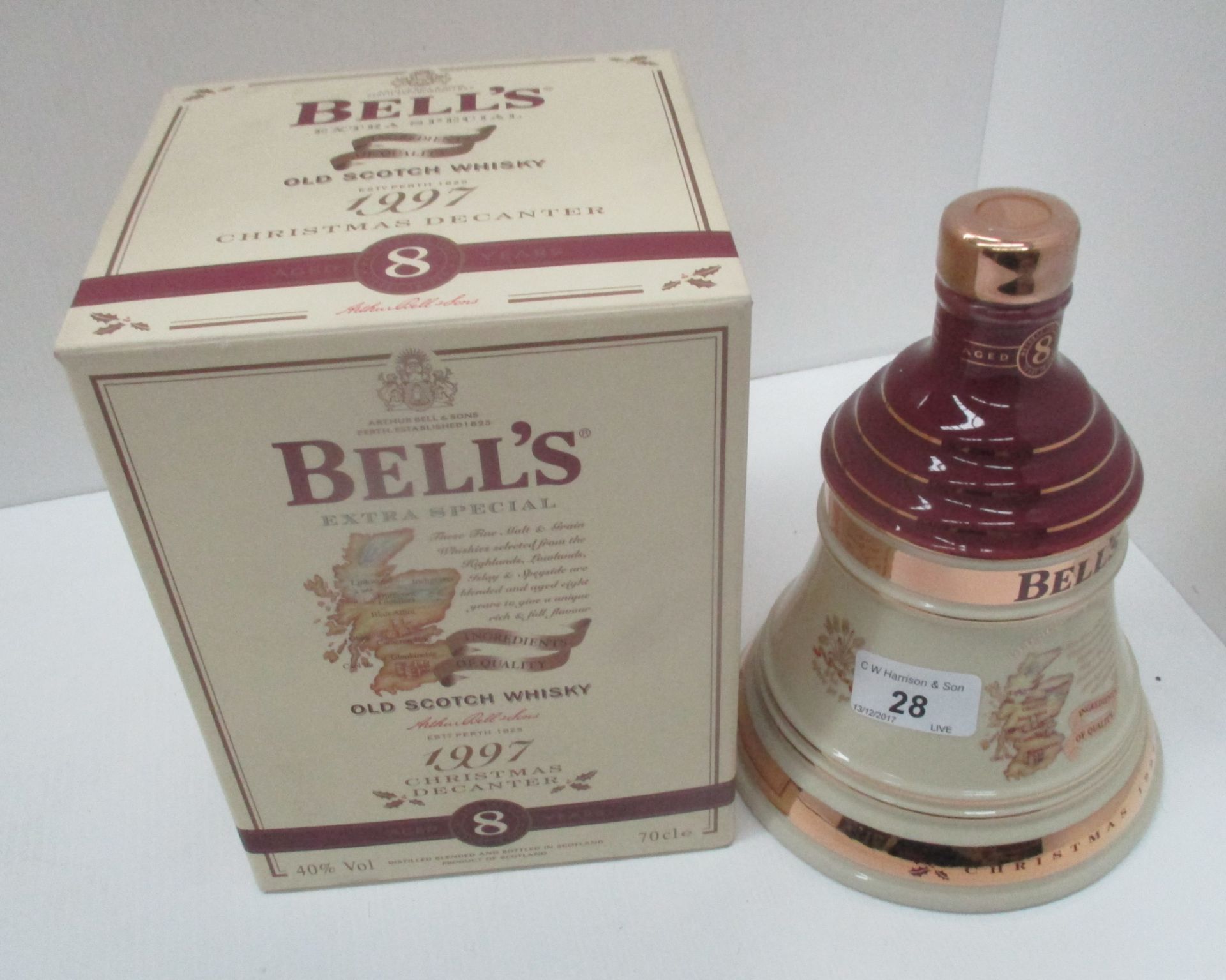 A 70cl Wade porcelain decanter containing Bell's Extra Special Old Scotch Whisky [aged 8 years] for