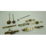 Seven assorted bar brooches - a 15ct gold brooch with pearl like stones,