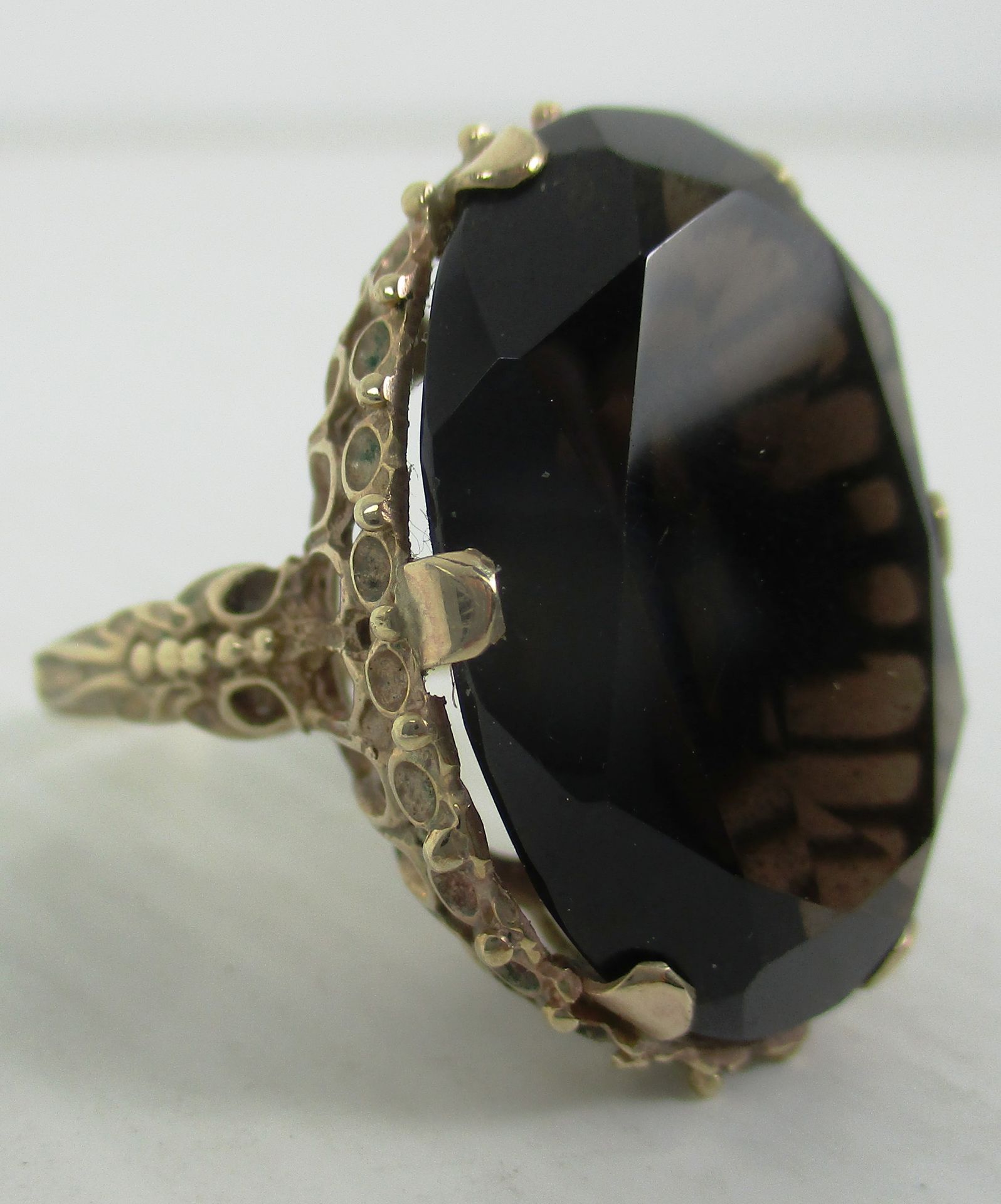 A 9ct gold ring with a large stone Further Information Ring measures 18mm on inside.