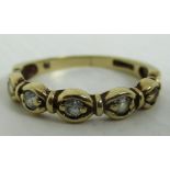 A 9ct gold half hoop eternity ring set with five cubic zirconia (total approx weight 1.