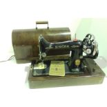 Singer portable hand operated sewing machine in case complete with instruction book