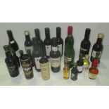 A mixed selection of 23 miniature bottles of wines and spirits including a 5cl bottle of Eradour 10