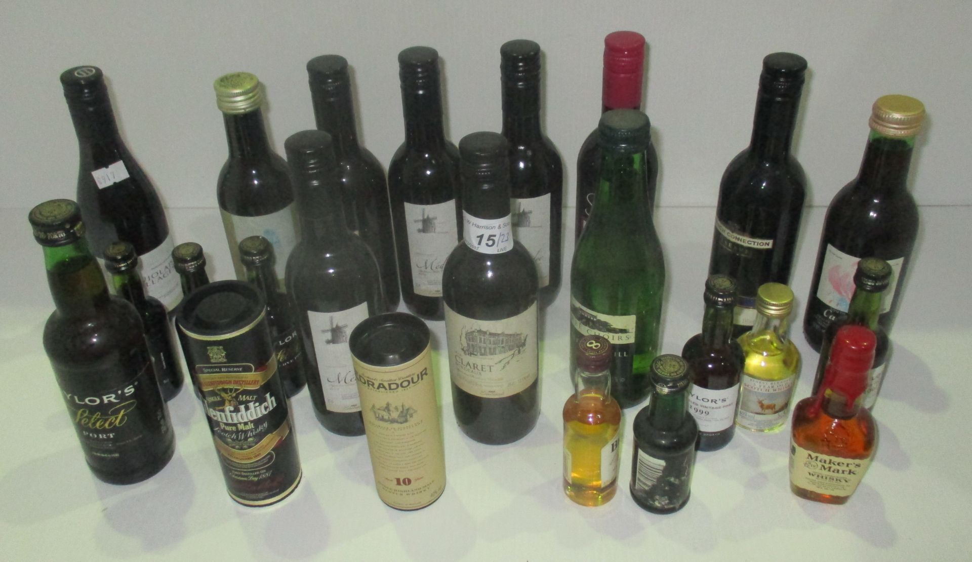 A mixed selection of 23 miniature bottles of wines and spirits including a 5cl bottle of Eradour 10