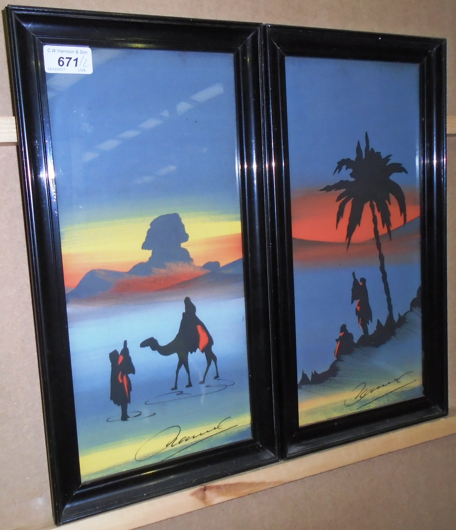 A pair of water colours 'Desert Scenes' in ebonised frames each 37 x 16cm (2)