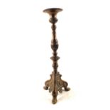 A large late 19th Century Bronze pricket candlestick with wide drip tray,